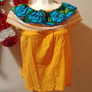 Embroidered yellow blouse with elastic neck. Size L